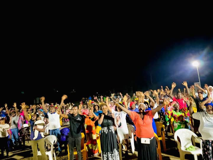Crowd responding during a night outreach service
